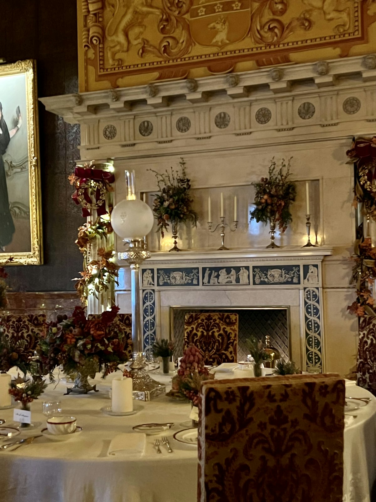 A candlelit dining room laid for dinner